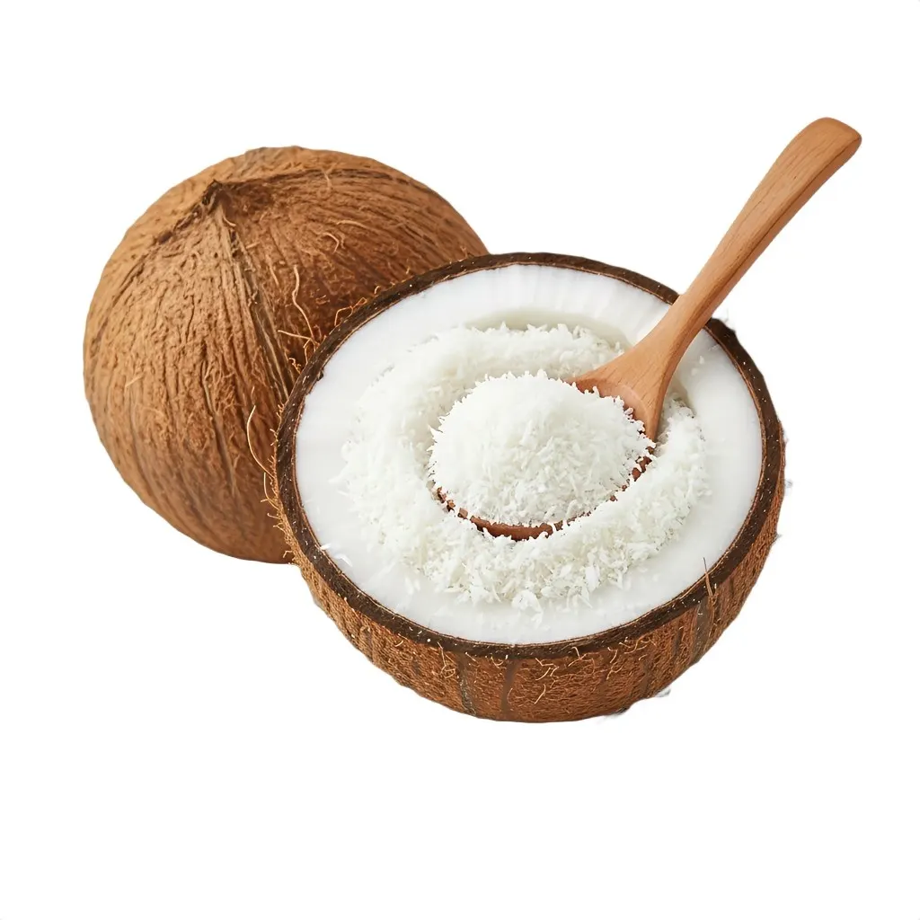 Bowl of fine snow-white desiccated coconut powder beside fresh half-cut coconuts